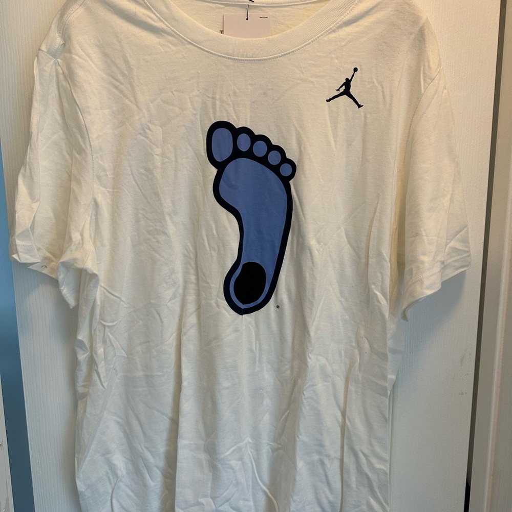 Nike White Tarheels Jordan Brand T-Shirt with Blue Footprint Graphic